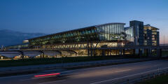 The illuminated terminal building at Leipzig/Halle Airport at dusk